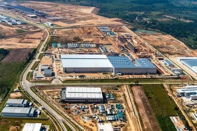 Aerial view of large factory and warehouse buildings under construction