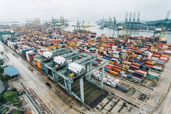 Aerial view of a container terminal with cranes and stacked containers